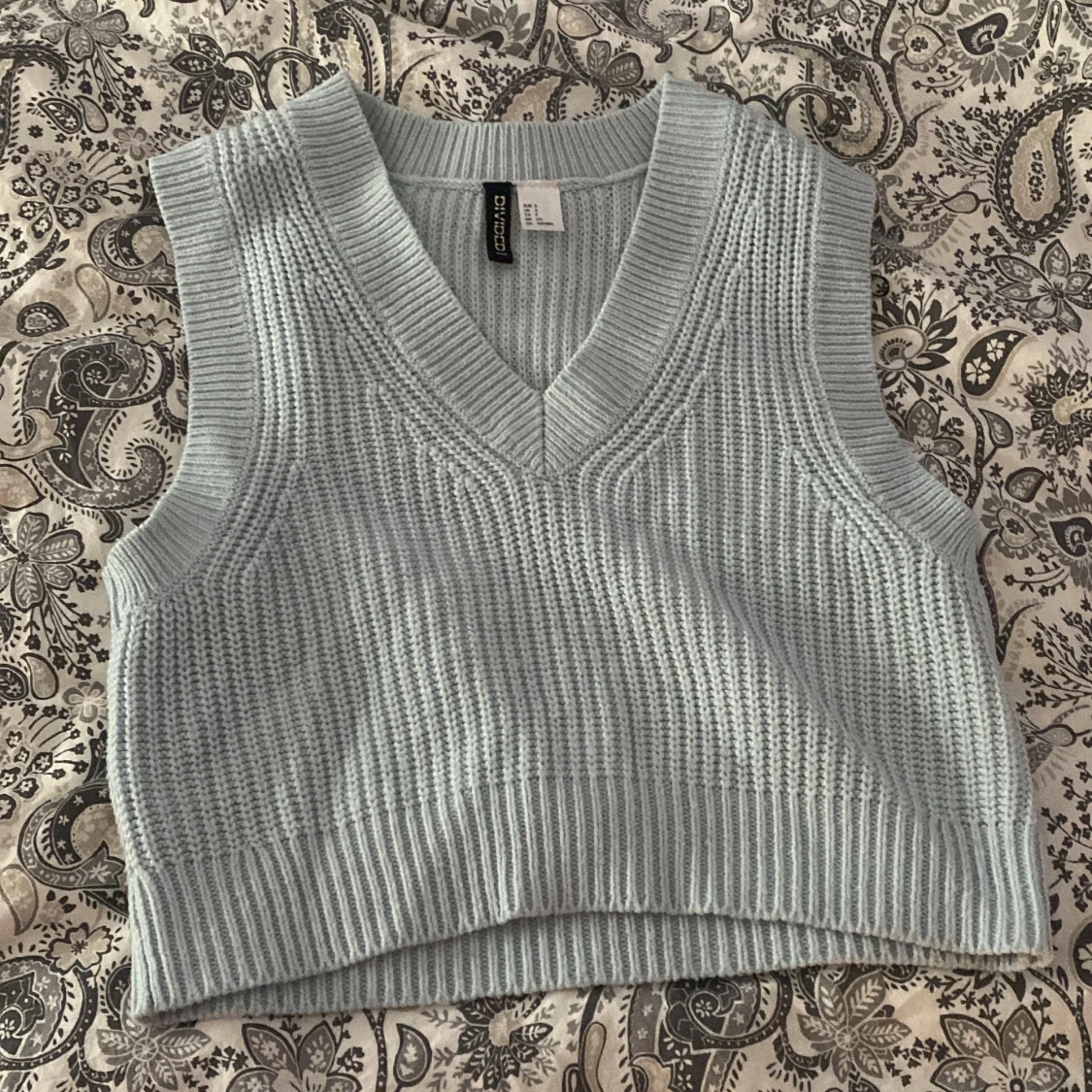 Ljusblå stickad väst från H&M