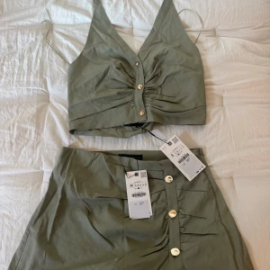 Zara set - Ett grönt Zara set aldrig använd med prislappen kvar. En skort och en topp med öppen rygg.  