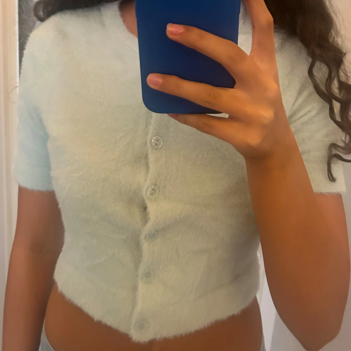 Ljusblå croppad stickad blus