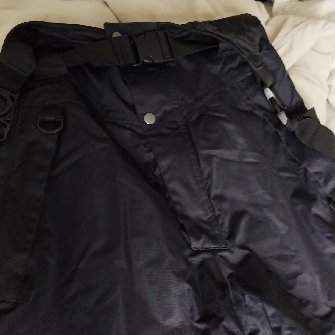 Svarta täckbyxor med reflexdetalj