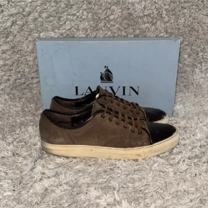 Lanvin skor - | Condition: 6/10 | Color: Brown, White and black | What is included: Box and sneakers | Retail price: 5 200kr |