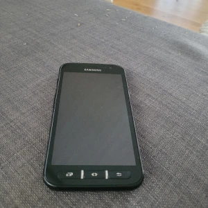 Mobiltelefon - Sparsamt använd 