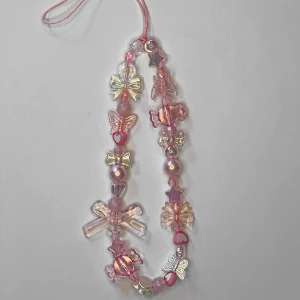 Rosa Mobil Slinga  - Längd: 23 cm. Kan mötas upp i Örebro.  Super fin 💕