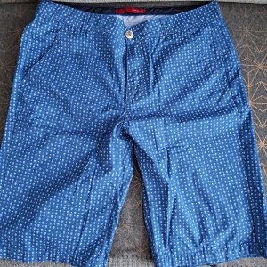 Zara blue shorts with white skulls - In good condition. Would prefer pick-up rather than posting.