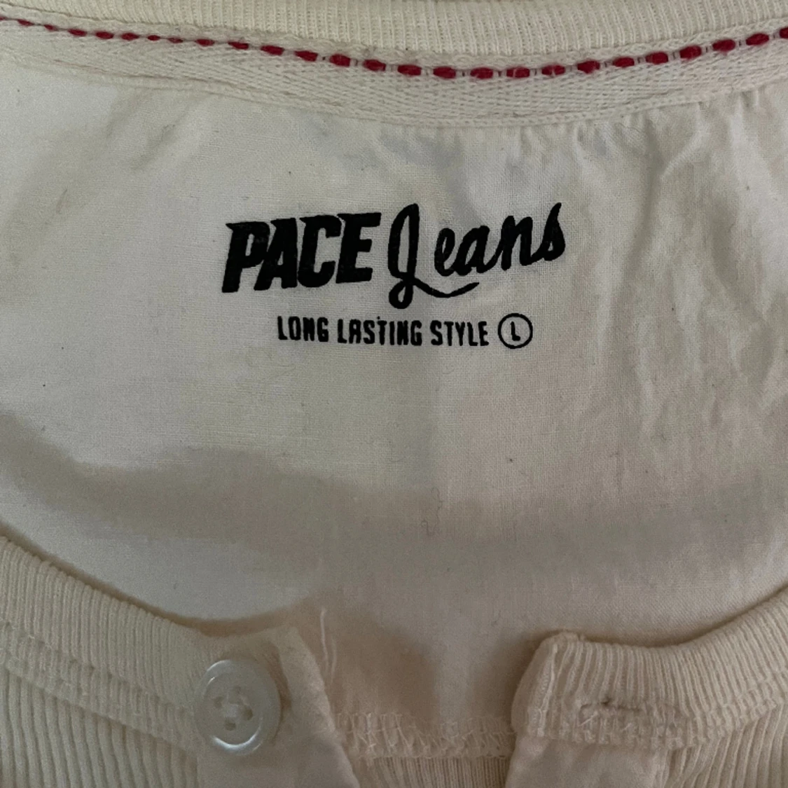 Långärmad tröja med knappar - 90