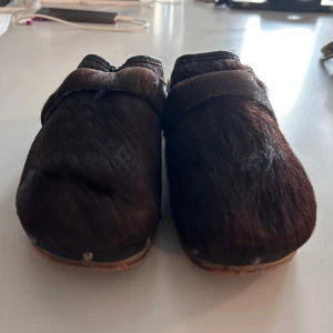 Kitten heeled furry shoes  - Wooden sole, fur on top  Never worn/ brand new  37/38