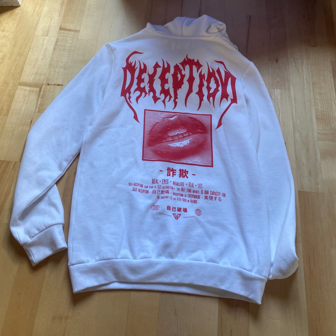 Vit huddie med tryck