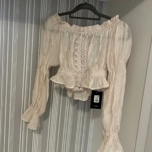 Blus  - Aldrig använda 