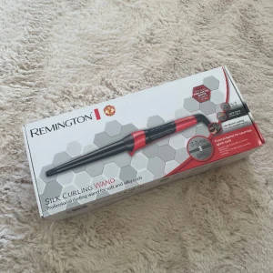 locktång - helt oanvänd remington curling wand med manchester united logga.