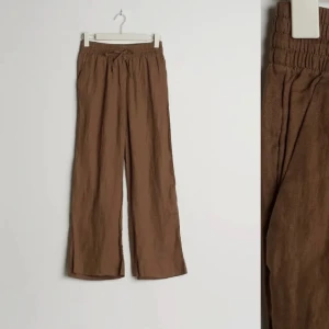 Bruna linnebyxor  - Bruna linnebyxor från gina tricot. Storlek 38 men passar 36 och 40.