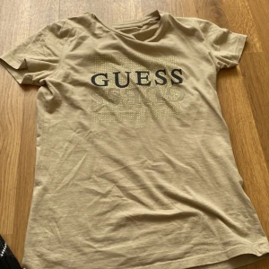 Guess t-shirt - Long,smallish,good condition,new