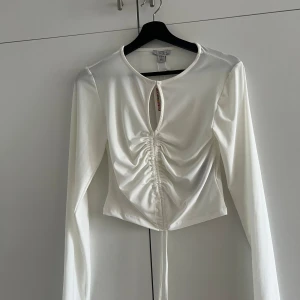 Topp - Ny med lappen kvar. Normal i storleken