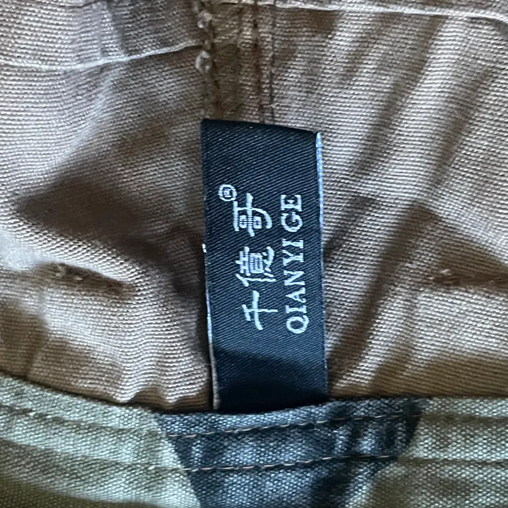 Chinese Brand Cargopants with multiple pockets, details and slight bootcut. Jeans & Byxor.