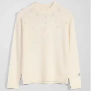 En stickad tröja med pärlor från MQ, märket Stockholm lm. Endast använd en gång då storleken var för liten. Ordinarie pris var 699kr.