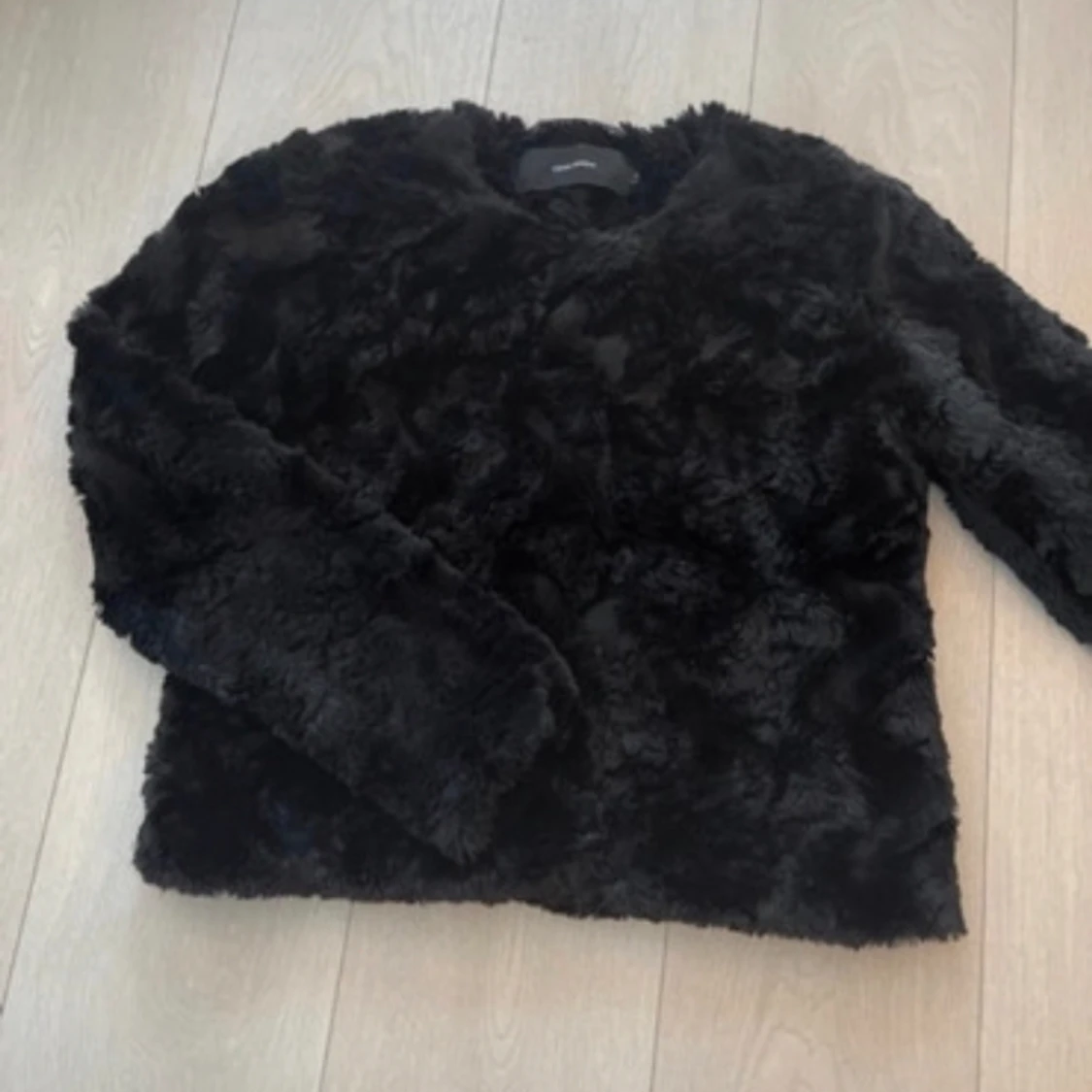 Svart pälsjacka 