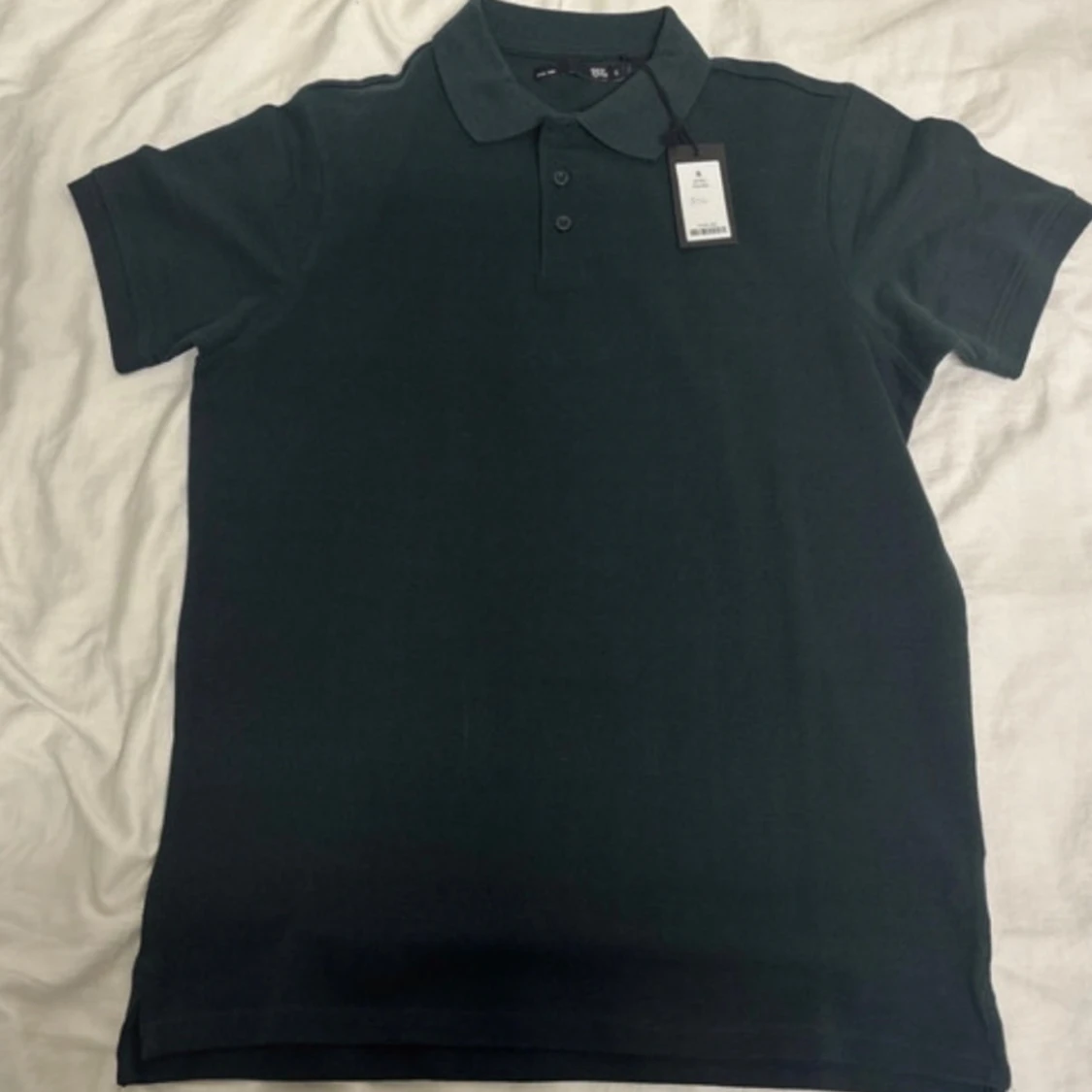 Mörkgrön pikétröja från 157