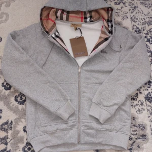 Burberry grey zip up zipper hoodie, S - ● Details: New with tags on, grey zipper from burberry, warm and comfy. ● Brand: burberry ● Size: Small  📦 Shipeed out the same day or the second!  Feel free to offer your price and if you have questions just message me 😁