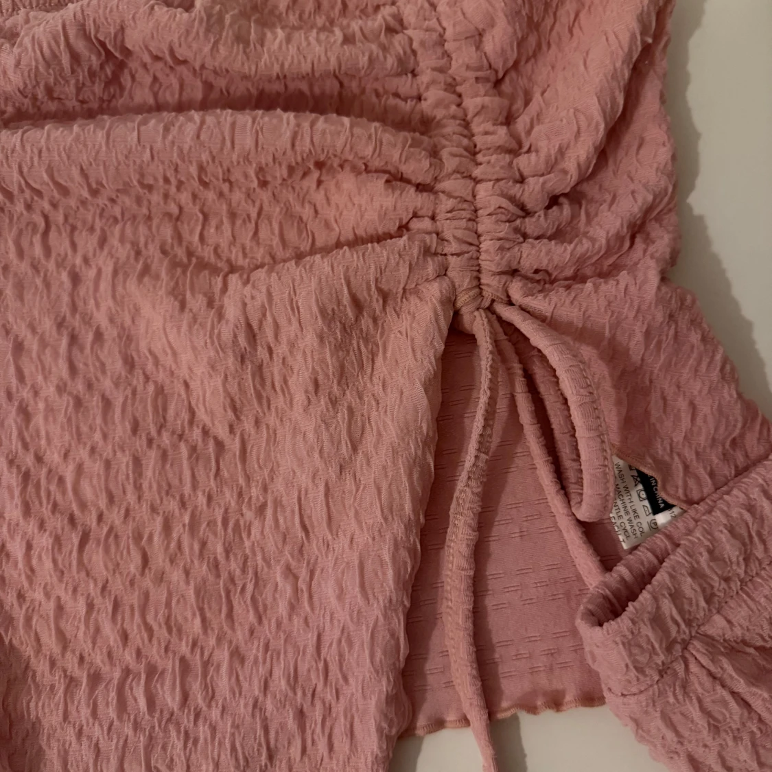 Rosa sätt med snörning