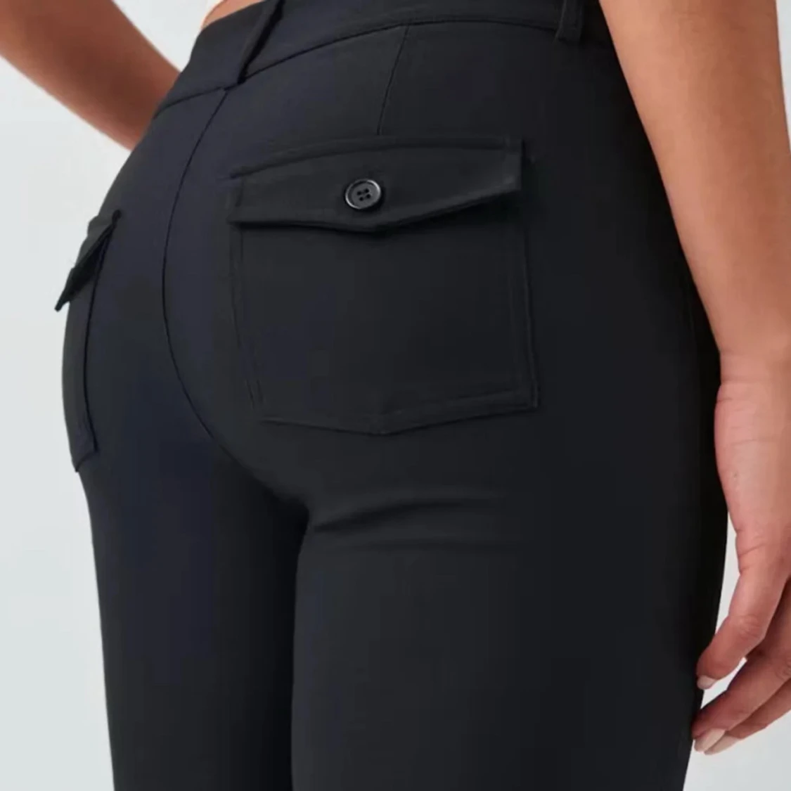 Svarta bootcut kostymbyxor med fickor