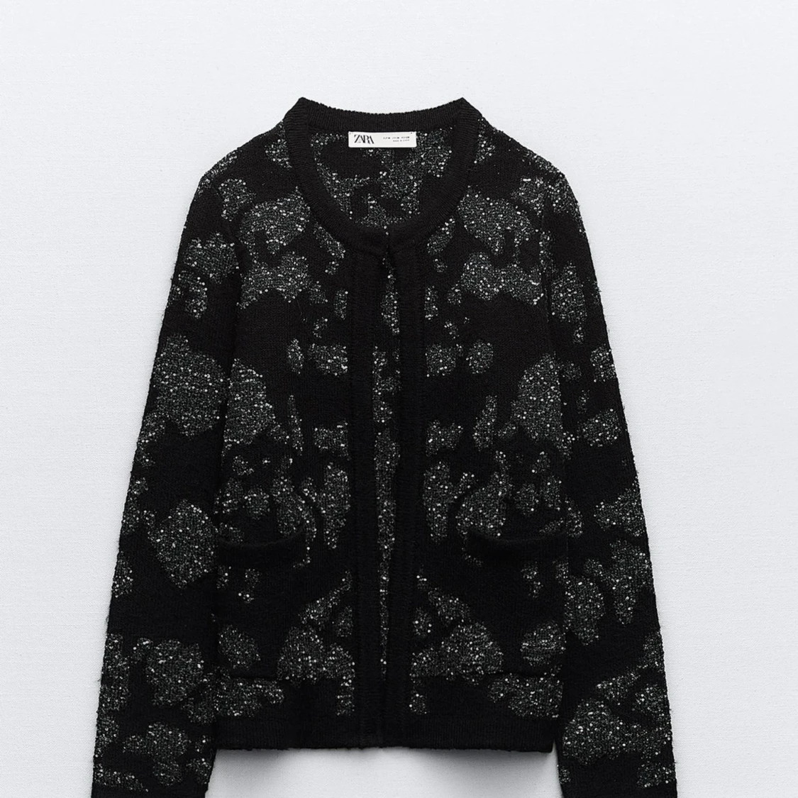 Svart glittrig kofta från Zara