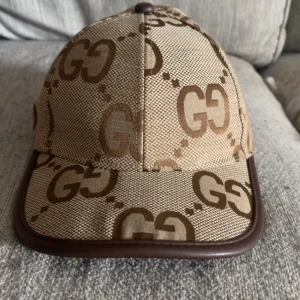 Gucci keps - En fin keps med märket ”Gucci” 