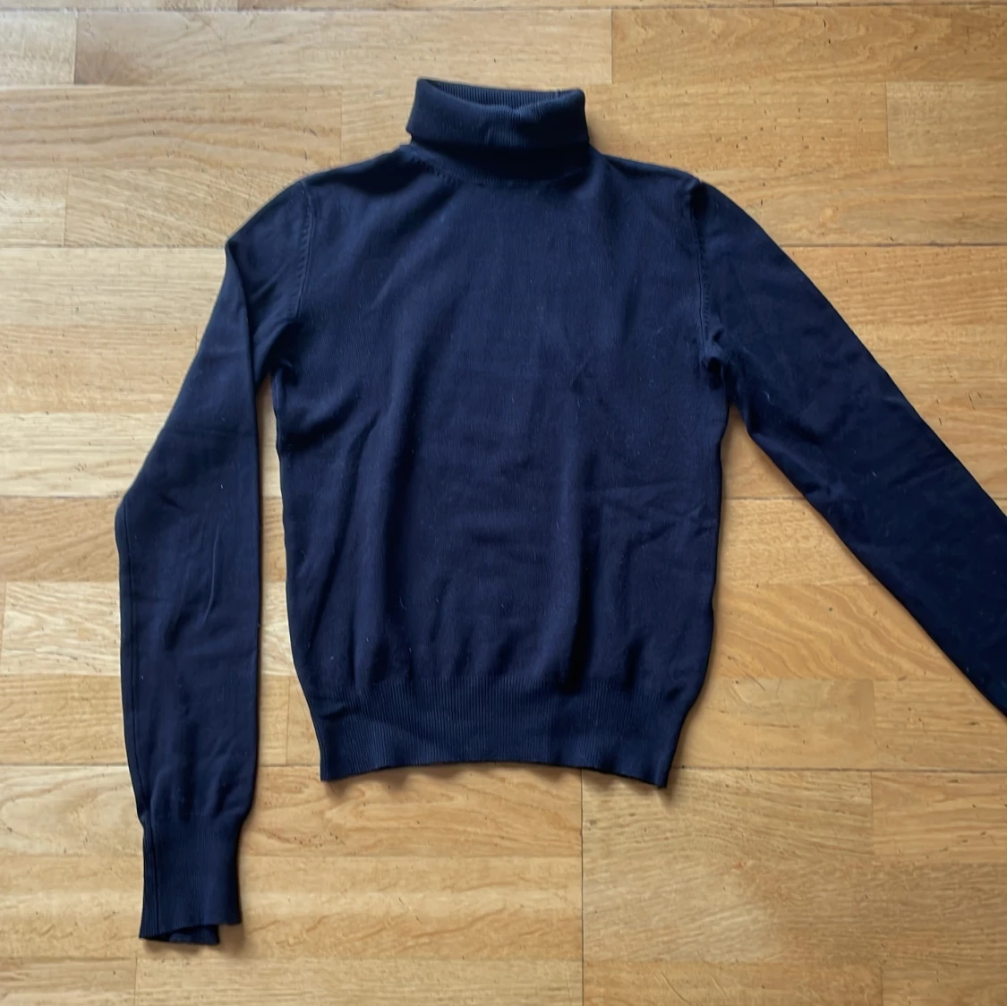 Svart polotröja från Bershka XS