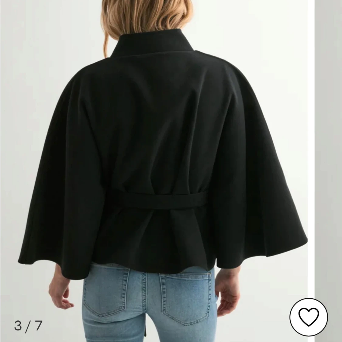 Svart ponchokappa från Nelly - 2