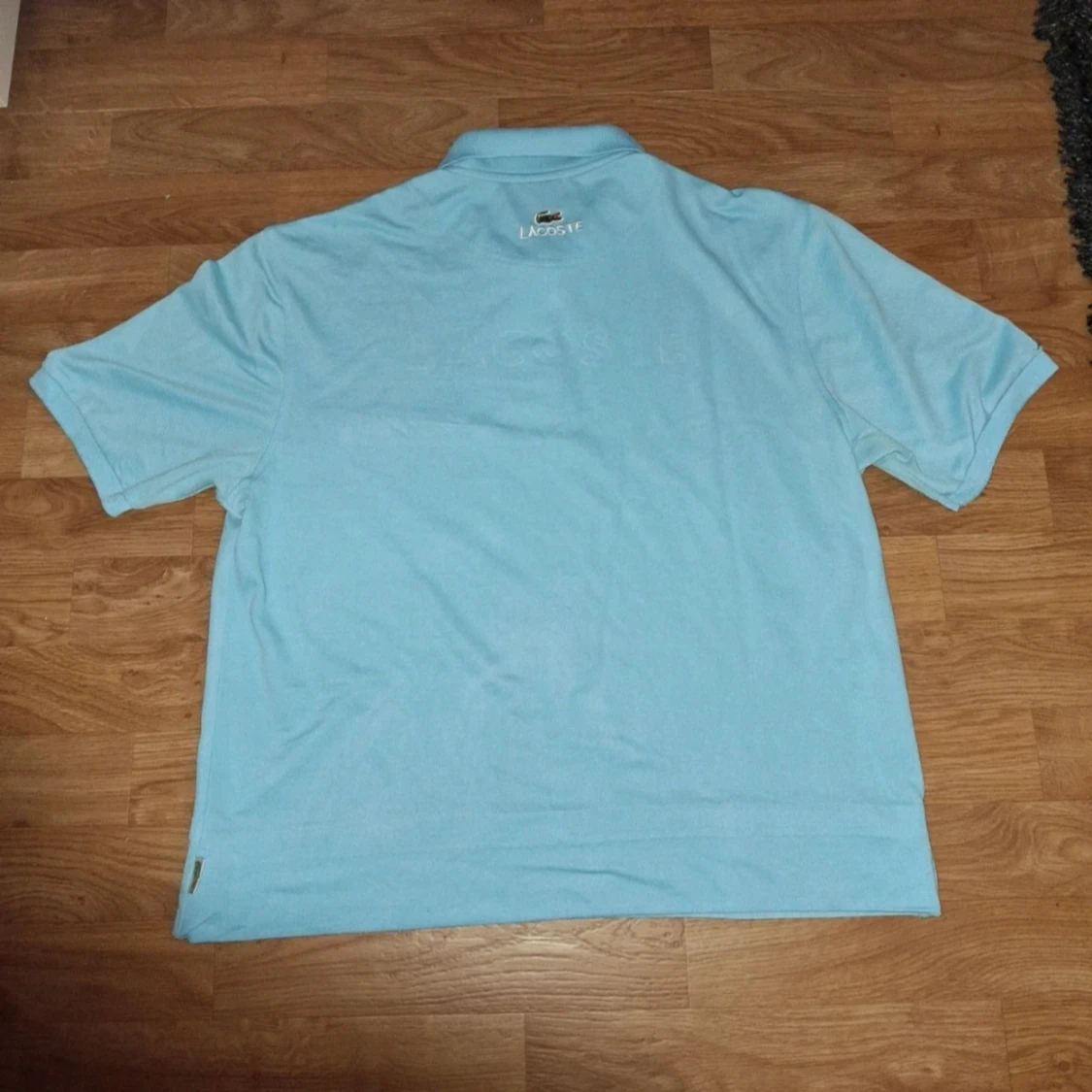 Ljusblå pikétröja från Lacoste - 1