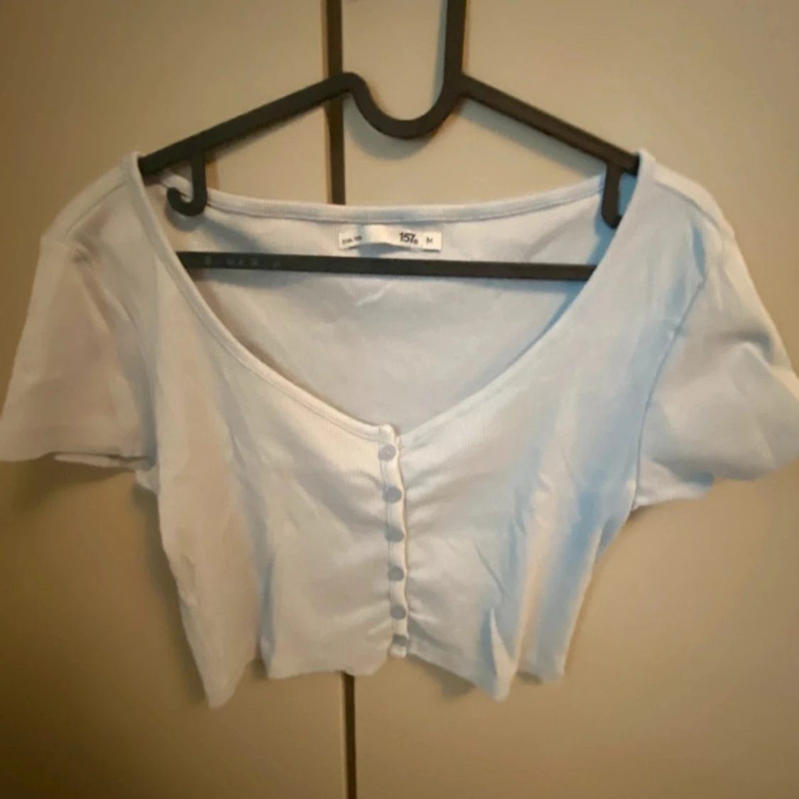 Ljusblå kortärmad topp från 157