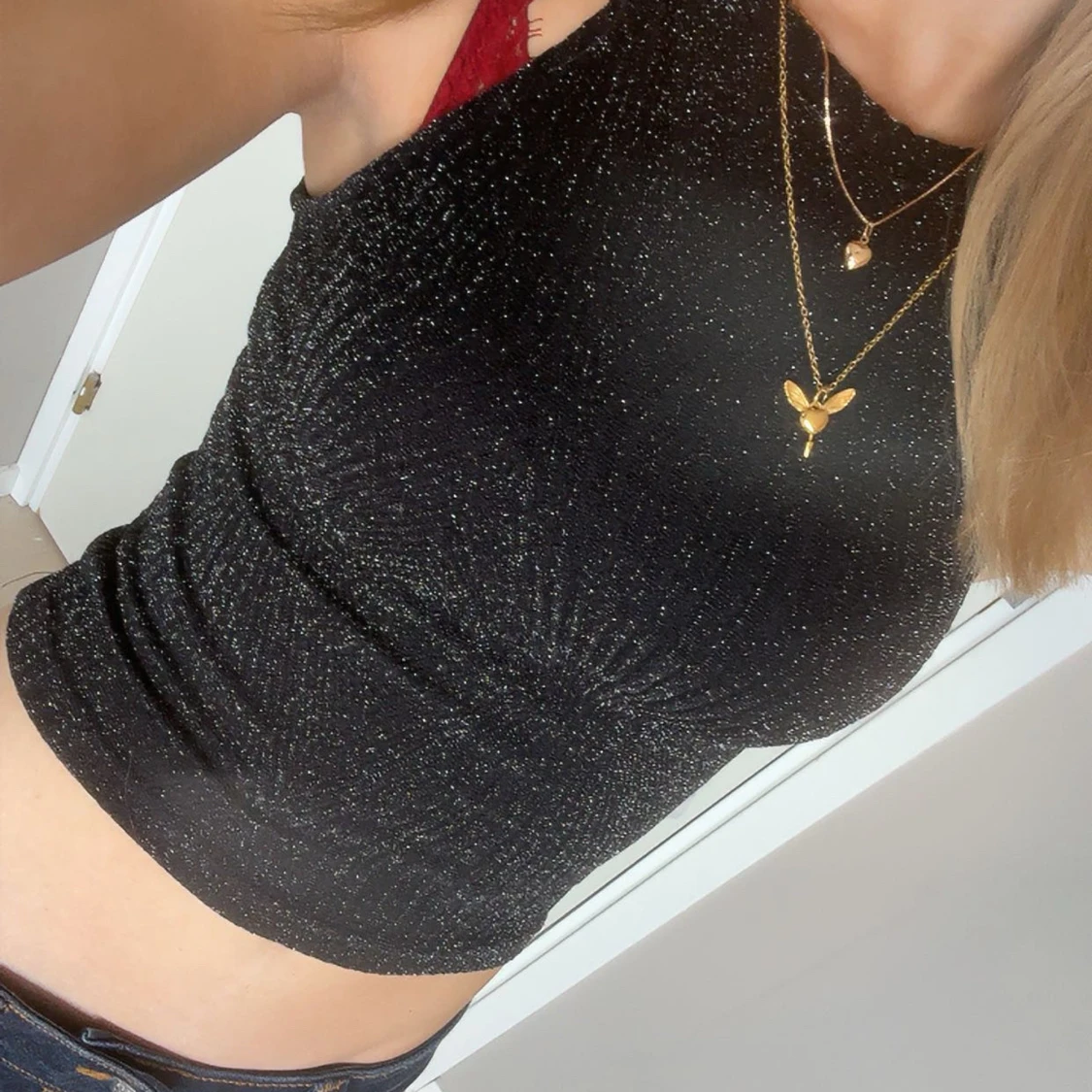 Svart glittrig ärmlös topp