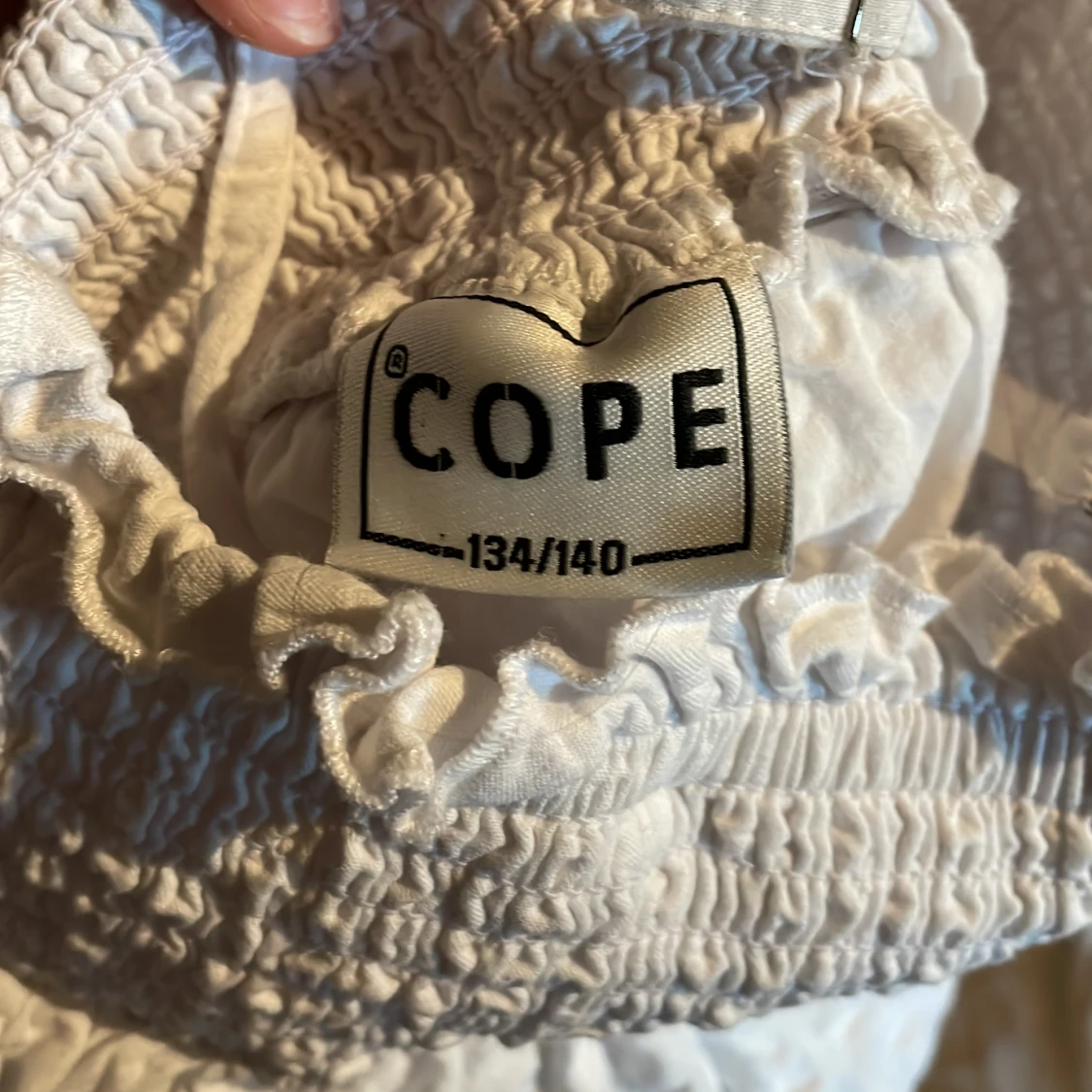 Vit linnetopp från Cope - 1