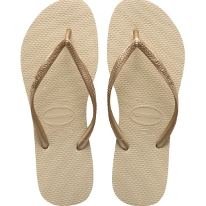Havaianas SLIM  - Säljer ett par flip-flops från havaianas i färgen sand grey/light gold. Väldigt fina och bekväma flipflops som är perfekta nu till sommaren☺️
