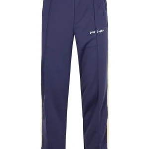 Mörkblå träningsbyxor från Palm Angels - Snygga mörkblå träningsbyxor från Palm Angels med raka ben och en vit logotyp på sidan. Byxorna har en bekväm passform och är perfekta för en sportig look. De har elastisk midja och sidofickor för extra funktionalitet.