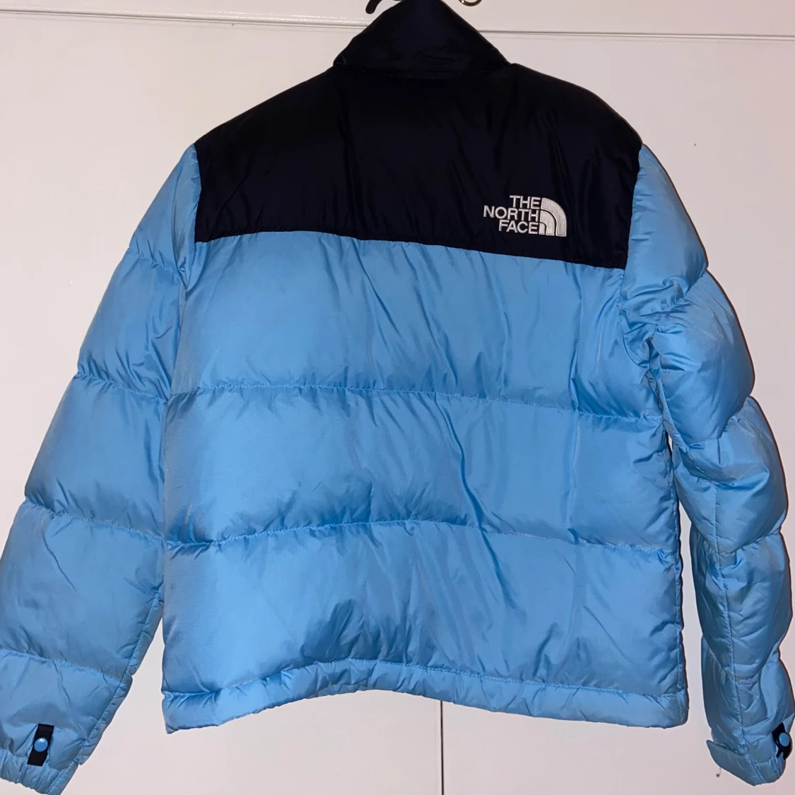 Blå pufferjacka från The North Face - 91