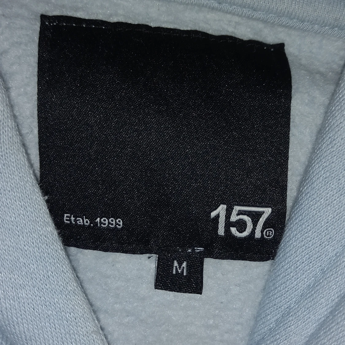 Ljusblå hoodie från 157 - 91