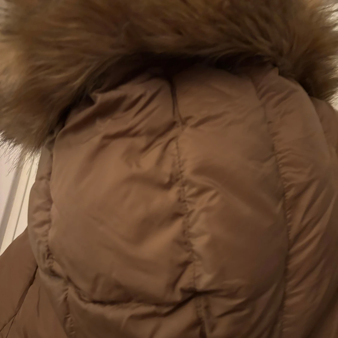 Brun dunjacka från Uniqlo - 91