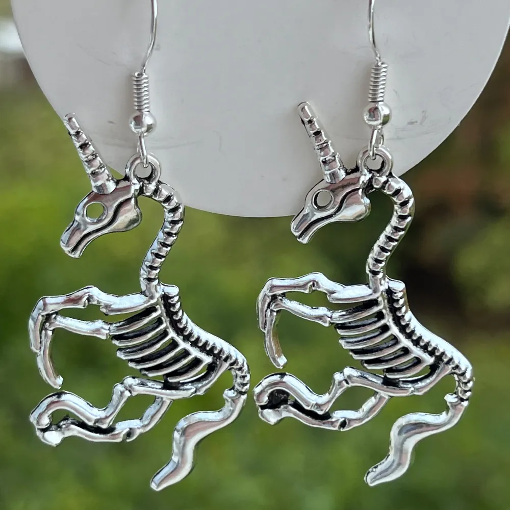 Handmade unicorn skeleton earrings.🎀. Accessoarer.