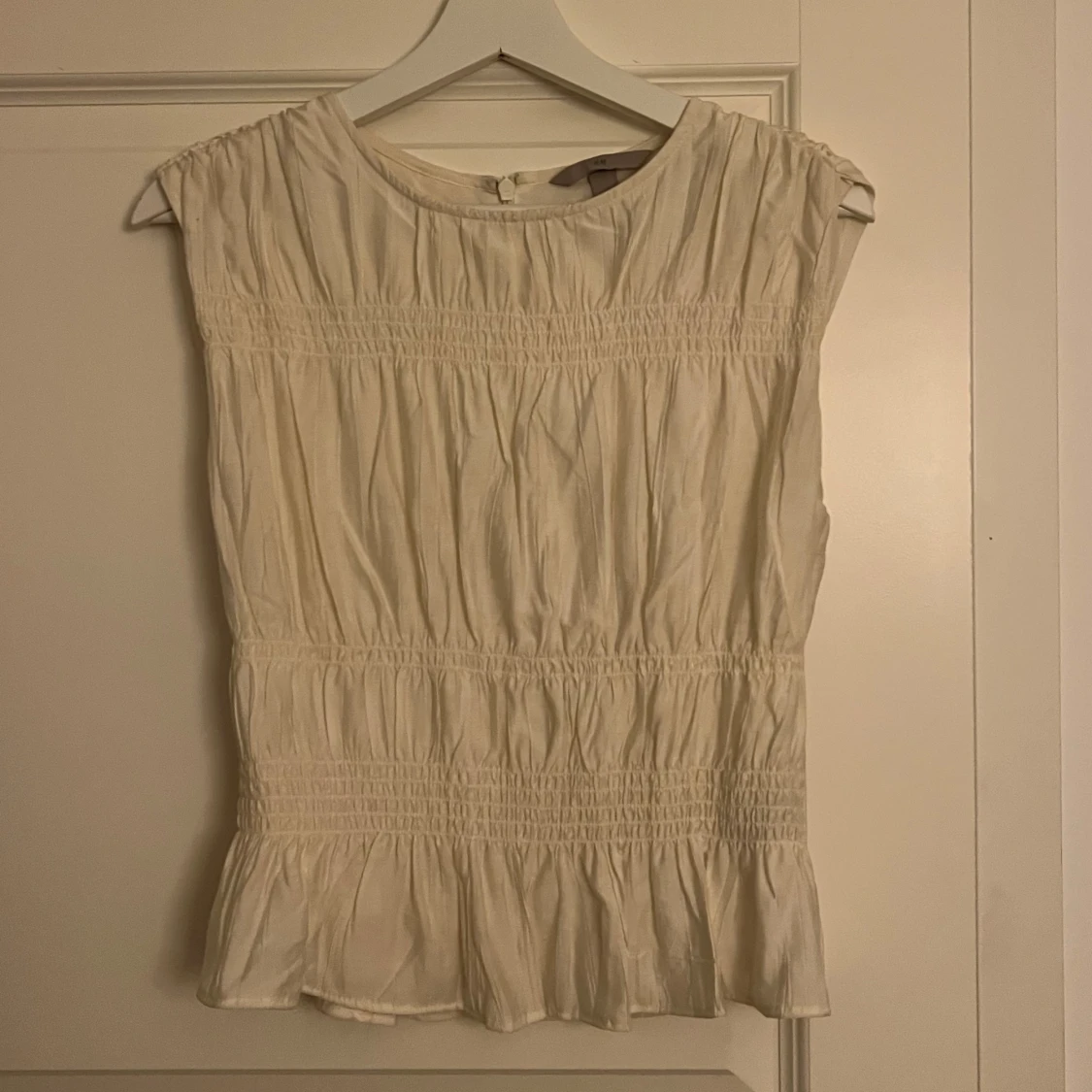 Vit ärmlös blus från H&M