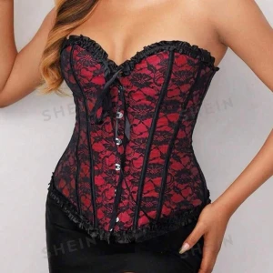 Svartröd korsett - En svartröd korsett, storlek M, aldrig amvänd, perfekt till halloween💋