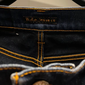 Nudie jeans - Säljer ett par öppna nudie grim tim jeans i storlek W28 L32! Hör av dig vid intresse eller frågor!