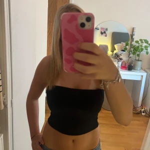 Glittrig bandeautopp - Glittrig topp i storlek M.