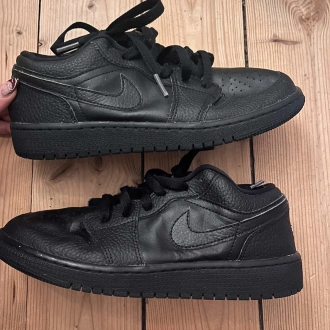Svarta Nike Air 1s