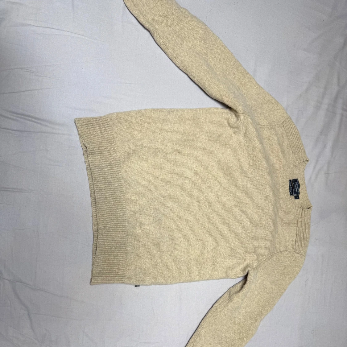 Beige stickad tröja från East West