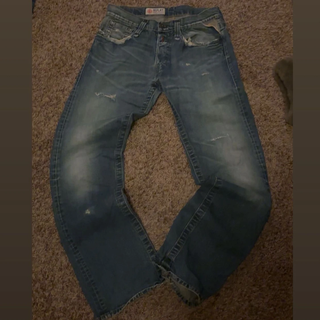 Blå Replay jeans med slitningar