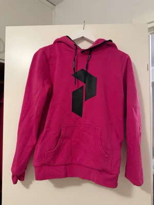 Hoodie från peakperformance - En rosa hoodie från peak performance