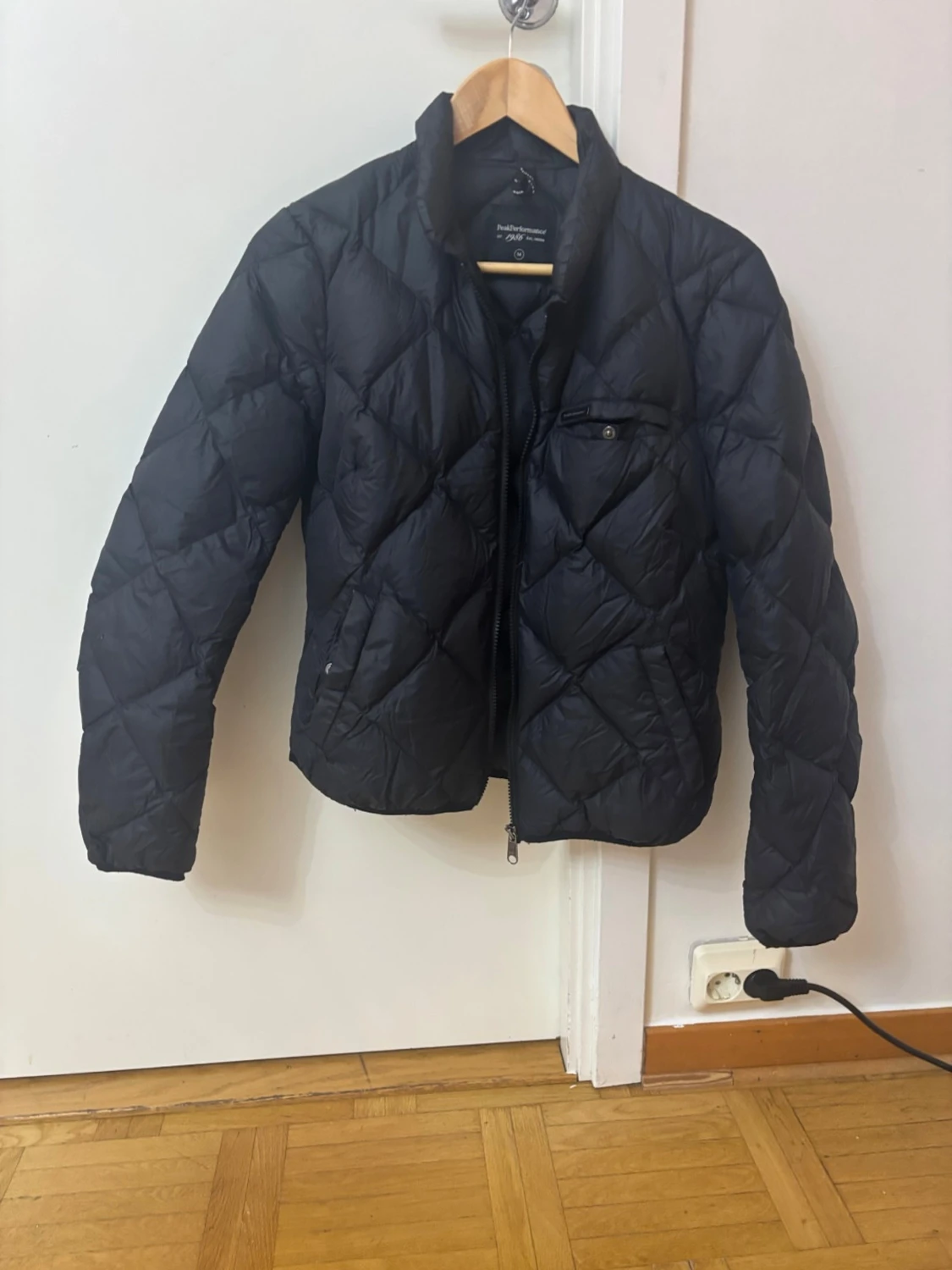 Svart quiltad pufferjacka Peak Performance