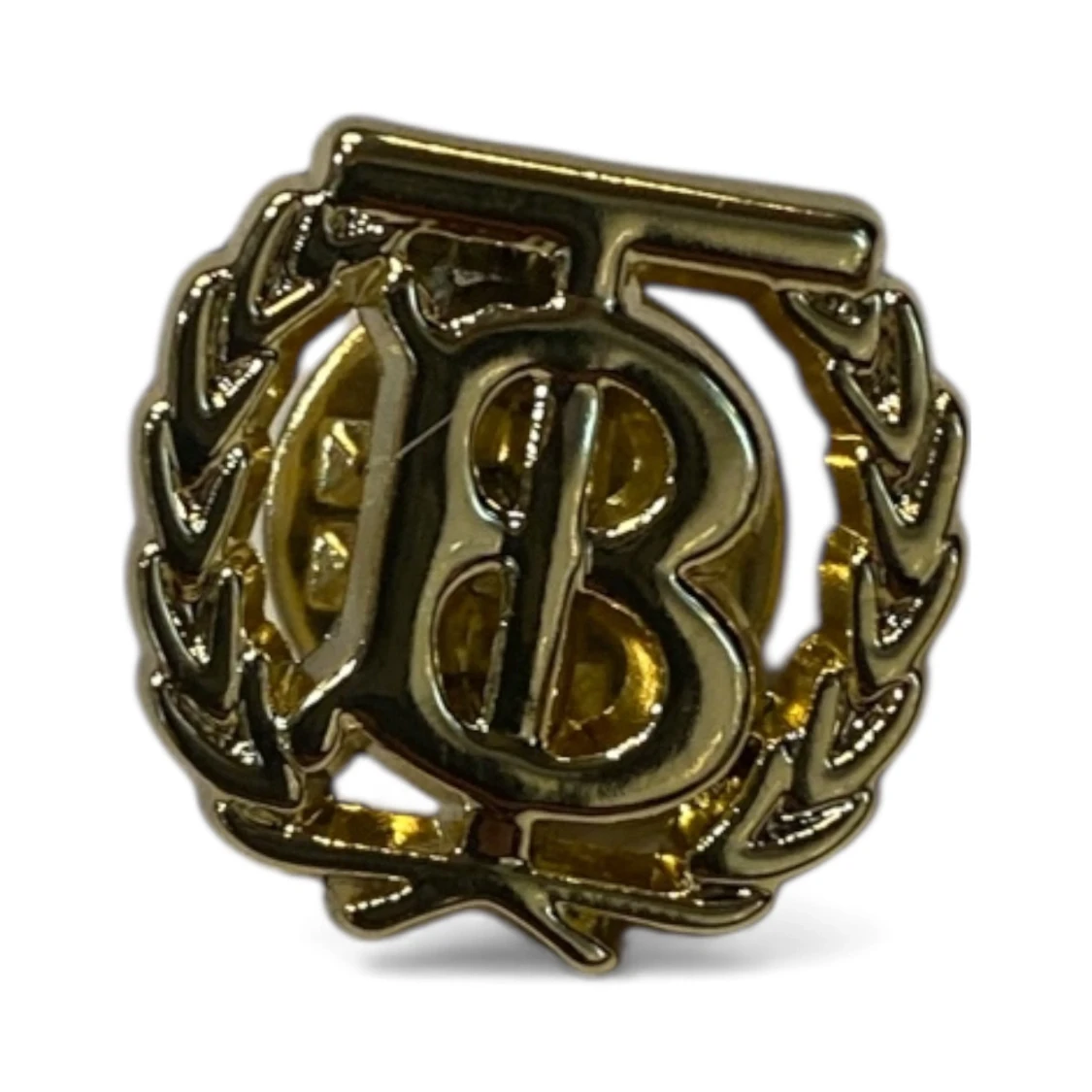 Guldfärgad B brosch