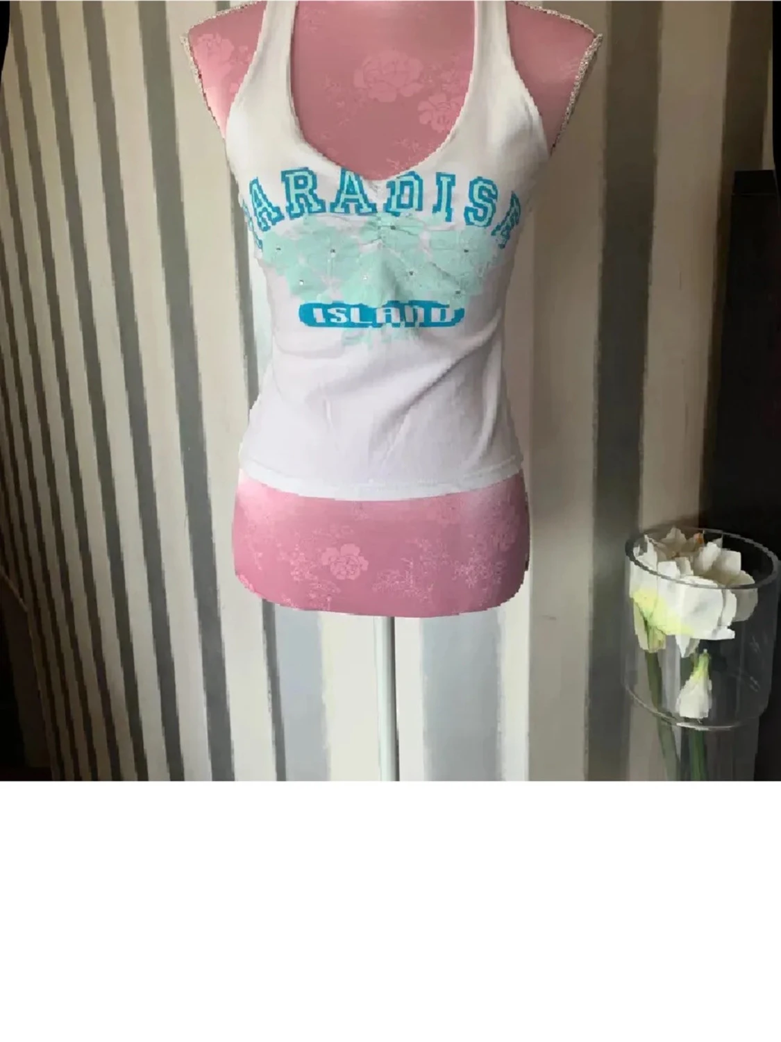 Vit linnetopp med turkost tryck