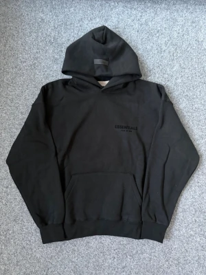Essentials black hoodie - Size M, brand new. True to size