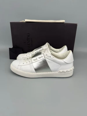 Valentino Open Sneaker Silver - • The shoes have been gently used and are in very good condition  • Size: 40.5 (fits 41–41.5)  • Color: Silver  • Retail price: 7280 SEK / 590€  • Box, dustbag & valentino card included